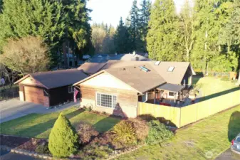 Beautiful Rambler on .56 of an acre lot w/salmon spawning creek just through the trees on the property!