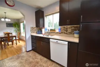 Bright and open kitchen w/granite countertops and stainless appliances. Lots of storage.