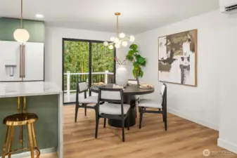 Eat in kitchen with dining space flows to exterior deck.