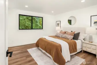 Primary with ensuite and walk-in closet.