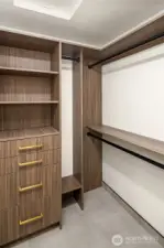 Custom walk-in closet in primary.