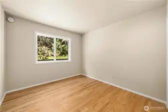 Light and airy secondary bedroom on the main floor.