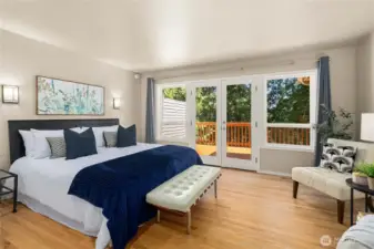 Private primary retreat with calming views and direct access to the deck.