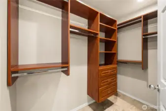 Primary walk-in closet with custom built-ins.