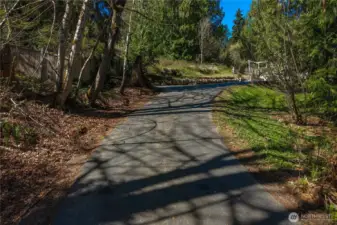 Long private drive leads to a peaceful retreat.