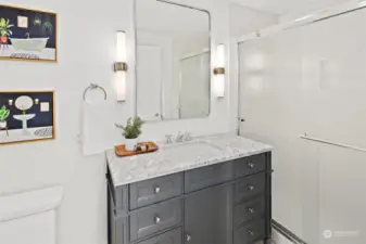The second home's bathroom features a walk in shower and heated floors.