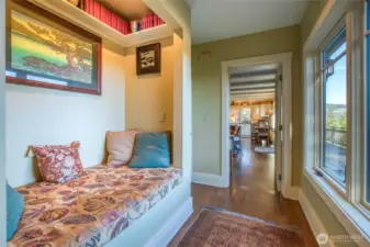 During the remodel the owners converted what was a dumbwaiter into a charming nook. The French door to the living area is great for controlling the various heating zones. Around the corner (not shown) is a closet currently used as a pantry.