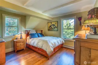 Main floor bedroom gets nice light with windows on two sides. All hydronic radiators were replaced along with the boiler in 2018. Floors throughout are oak hardwood.