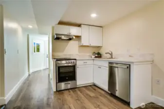 The addition of this kitchen enhances this rental opportunity, mother-in-law space or guest suite. Featuring stainless steel appliances, quartz countertops, and ample storage, this well-appointed kitchen is truly exceptional.
