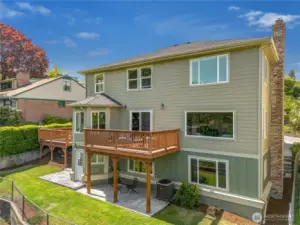 The stairs on the right at the front of the home head down to the separate entrance in the family room downstairs. The door from the lower level allows access out to the patio for this separate space.