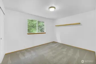 Bedroom #3 on the second floor. All three extra bedrooms face the greenbelt behind the home.
