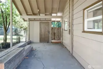 Attached carport offers covered parking and easy access to the home and a bonus storage shed for tools, hobbies, or seasonal items.