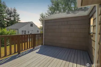 The back deck is ready for summer barbecues, gatherings, or quiet mornings.