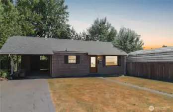 Virtual twilight view highlights the home's welcoming charm and curb appeal.