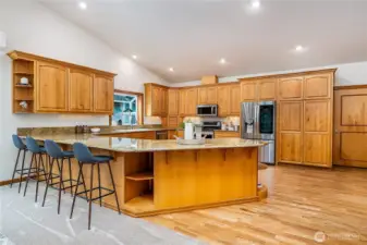 View of Kitchen from the Dining Room. Look at all those cabinets! There is tons of storage for all your cooking tools and gadgets.
