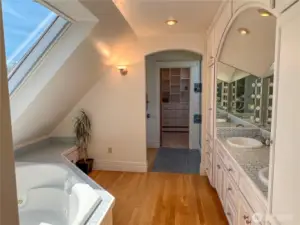 Roomy primary bath with double sinks, jetted tub, toilet, bidet, shower and walk-in closet.
