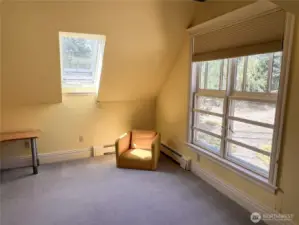 Second bedroom with skylight, double window and walk-in closet.