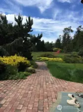 Lush greenery beautify the west side yard.