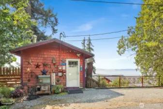The 560 square foot "tiny home" provides living space or a job-shack while building a new residence