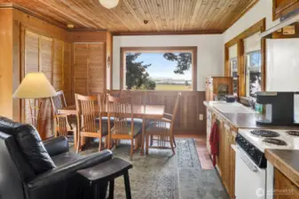 Inside, find living on two levels. The upper/main level features a small kitchen and dining/ living space