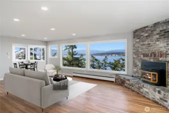 Spacious living room with breathtaking views and a cozy propane fireplace.
