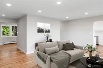 Looking from the living room toward the front of the house. The kitchen is to the right and dining room to the left.
