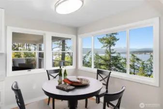 Charming breakfast nook off the kitchen with stunning water and mountain views.