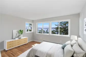 Ensuite primary bedroom with spectacular Olympic Mountain and Discovery Bay views.