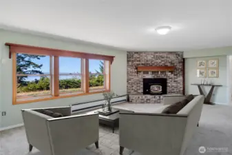 The lower level family room is off of the lower kitchen. It has great views of the water and mountains.