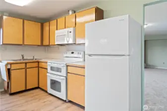 Second eat-in kitchen ideal for multigenerational living or entertaining, featuring beautiful water and mountain views.