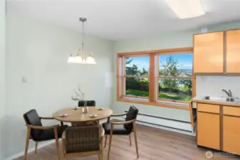 Cozy eating area in the second kitchen, perfectly situated by the window with mountain and water views.