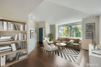 Virtually staged but shows the light filled living room upon entering.