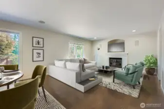 Family room just off kitchen features a gas fireplace.