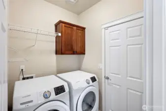 Laundry/mudroom between kitchen and garage.