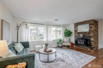 Eastern exposure living room windows soak the space in natural light.