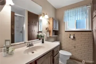 Bath in basement is adjacent to bedroom, rec room and bonus room