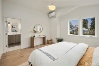 Primary suite showing access to bathroom