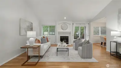 Living room with high vaulted ceilings. Freshly painted