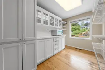 Oversized pantry with convenient prep counterspace.