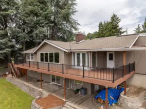 Huge newer Trex deck full length of the house and partially covered great for entertaining.