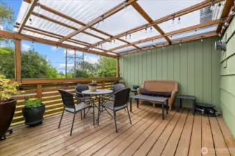 Inviting covered porch offers many entertaining options.