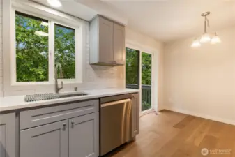 Kitchen looking toward dinning room and slideer to back deck