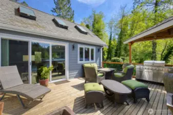 Spacious deck and entertainment area overlooking the lake
