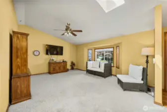 The living room faces the front of the house and with the bay window and skylight, the light just streams through.