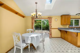 Dining area with another skylight.  This house lives so light and bright!
