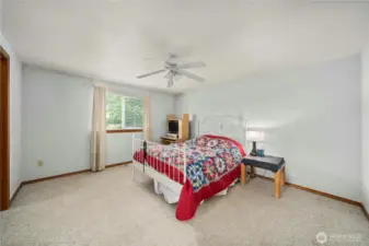 Large primary bedroom with its own walk-in closet and primary bath.