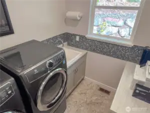 Also a handy deep sink in the utility room, window and aesthetically pleasing accent telework.