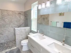 Beautifully tiled primary bathroom.