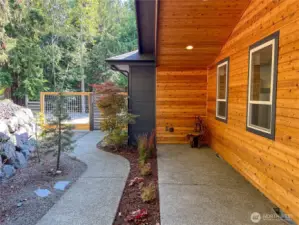 Accessible, pleasant, paved pathway to the front door from the concrete pad driveway.