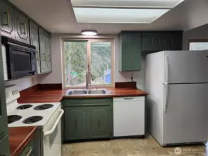 Kitchen has a NEW dishwasher, big frig and other older appliances